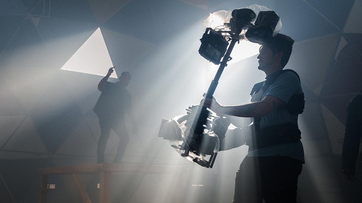 Behind the scenes image of a steadicam operator.