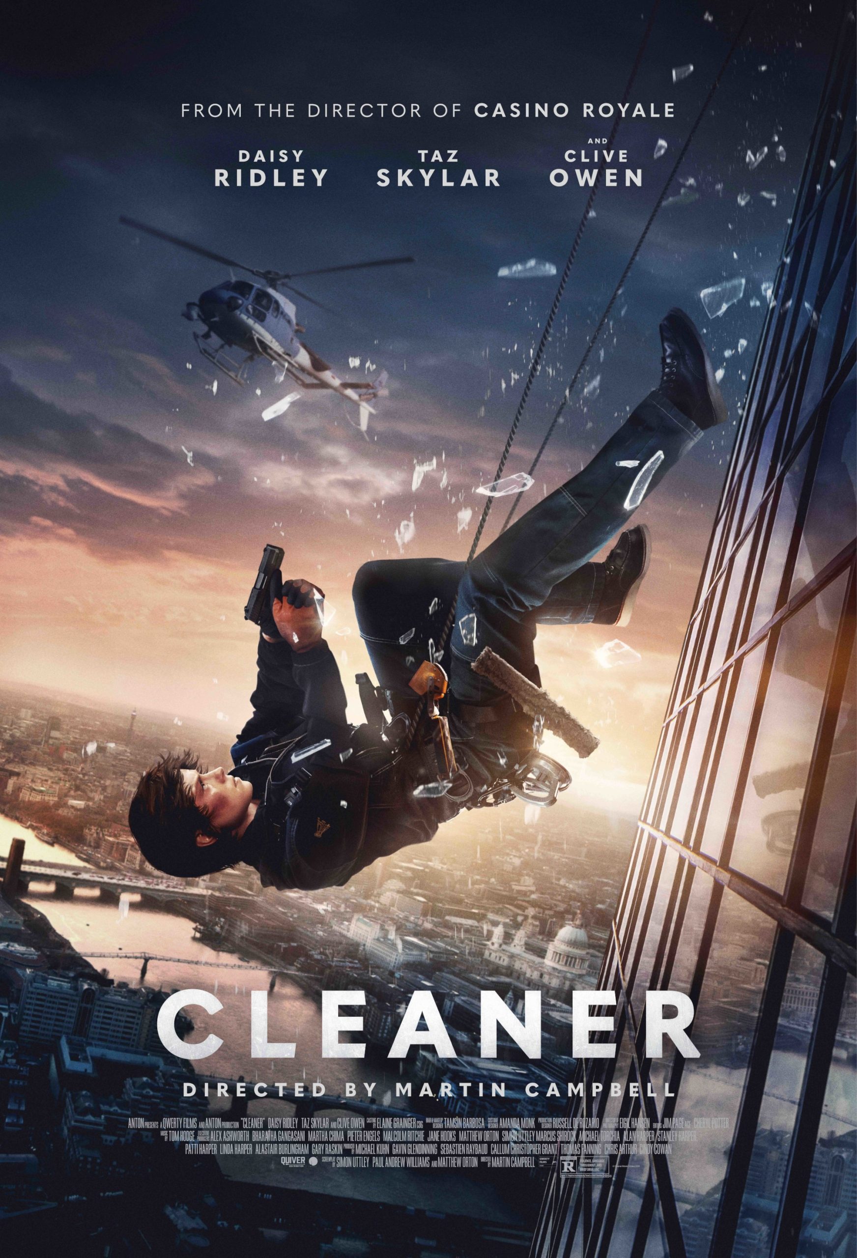 A movie poster for "Cleaner" showing lead actress Daisy Ridley in tactical gear, suspended mid-air against the glass side of a skyscraper, gun raised and body inverted. Shattered glass floats around her with a helicopter in the background and a city skyline below at sunset.